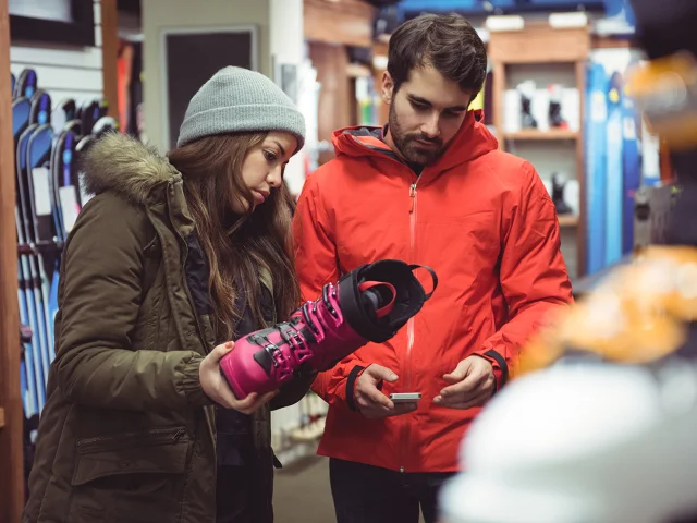 Couple selecting shoe together in a shop